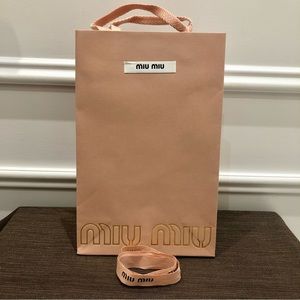 Authentic MIU MIU pink small gift bag with ribbon. Excellent condition.